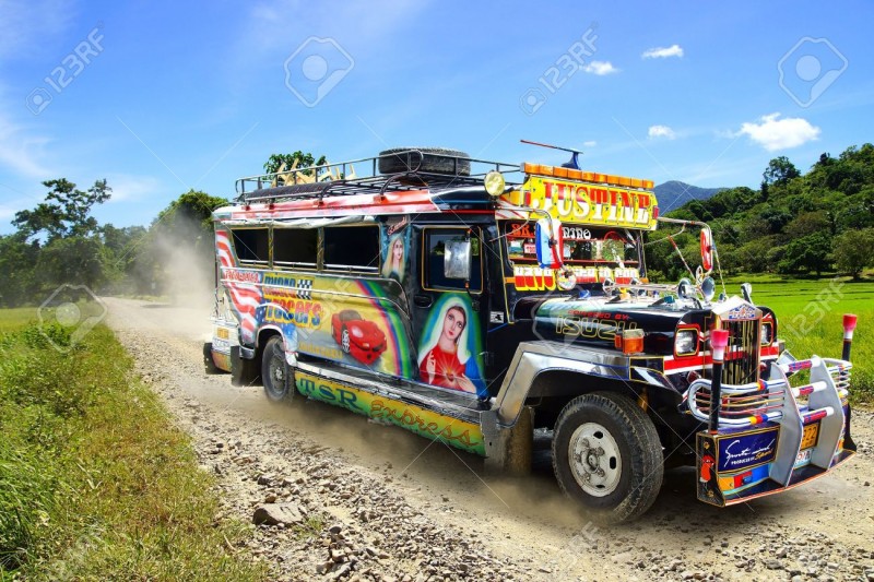 18614517-Jeepney-on-a-rural-road-Bohol-Island-Philippines-Stock-Photo
